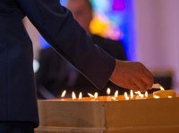 Candles alight in church for memorial service.