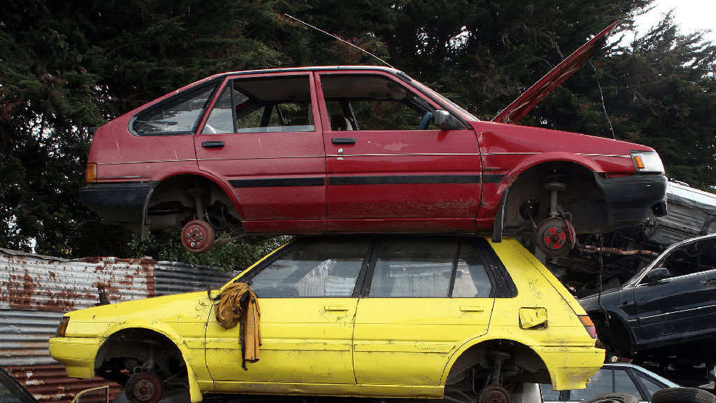 The red car found abandoned outside a wrecker’s yard