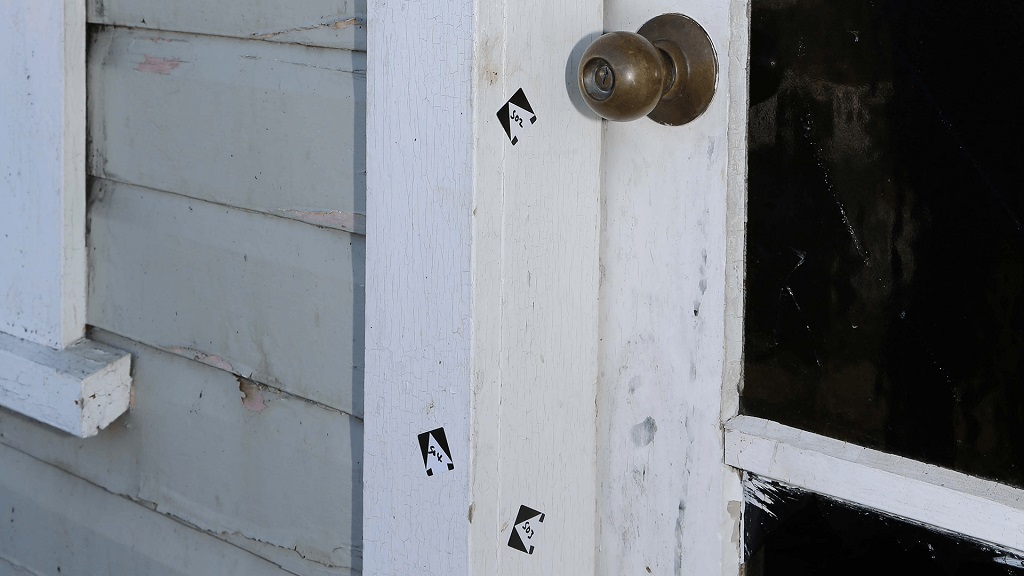 Blood smears on the door frame.