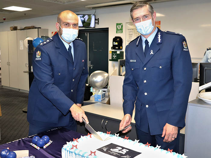 Inspector Haralambos Harvey with Commissioner Andrew Coster