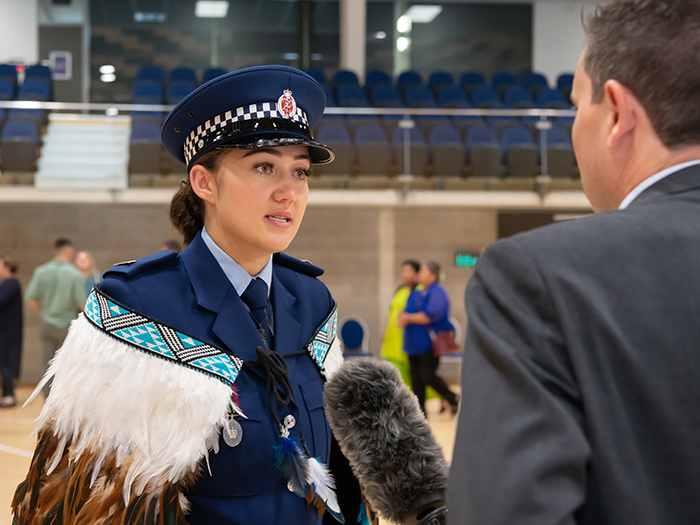 Constable Holly Cameron talking to media at her graduation.