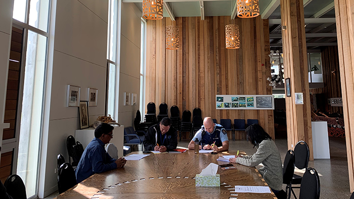 Paul Patel, left, and panel members prepare for the next participant.