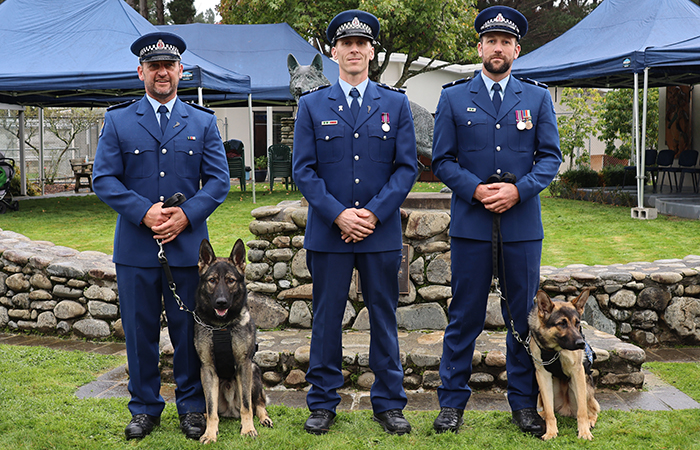 .Constable Aaron Senior with Cole, Head of Tasman District Dog Section Sergeant Craig Moore and Senior Constable Andrew Lillie with Buzz.