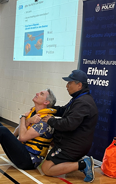 Demonstrating how to use a lifejacket.