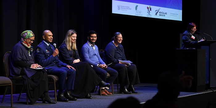 Superintendent Rakesh Naidoo speaks during one of the panel sessions. With him on the panel are Mastura Abd Rahman, Ministry of Education; Fiona Whiteridge, Immigration NZ; Raj Singh, Te Whatu Ora; and Serena Curtis - Ministry of Social Development, and Lillian Pak, Immigration New Zealand. (Photo - NZRAP)