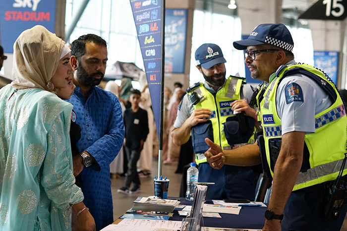 Police staff chatting to people at the Eid event at Sky Stadium in Wellington.