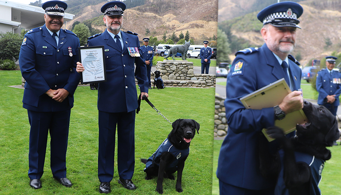 Senior Constable Lauris Shepherd and Arc with Superintendent Warwick Morehu.