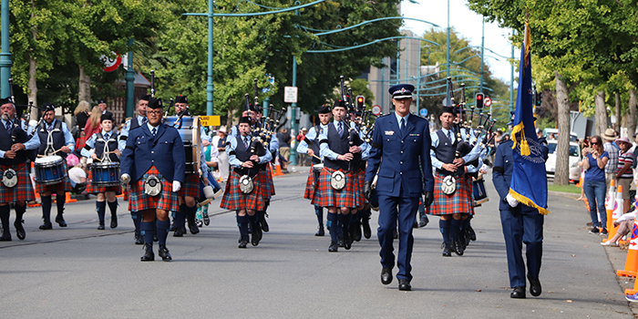 New Zealand Pipe Band marching down the street.