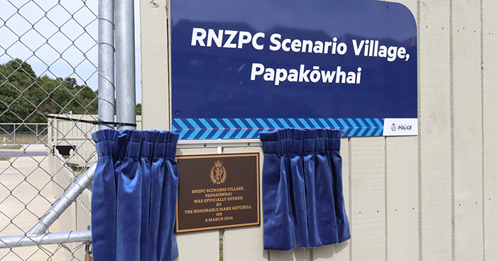 The RNZPC Scenario Village sign and plaque.