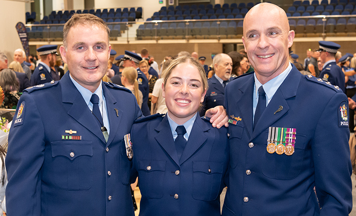 Constable Aleisha Scott with her dad, Inspector Craig Scott (right), and uncle Senior Sergeant Chris Scott. Senior Sergeant Richard Scott, another uncle, couldn't be there..