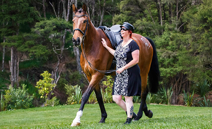 Transcription officer Kyrie Gausden, off duty with her horse Duet.