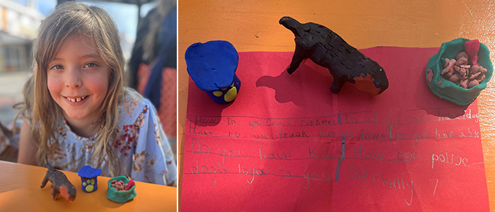 Bethany with the clay models she made to give to officers.