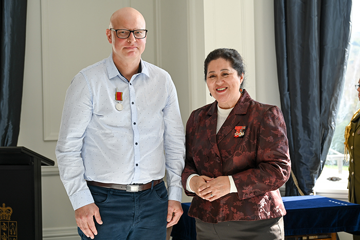 Former Senior Constable Kurt Waugh with Dame Cindy.