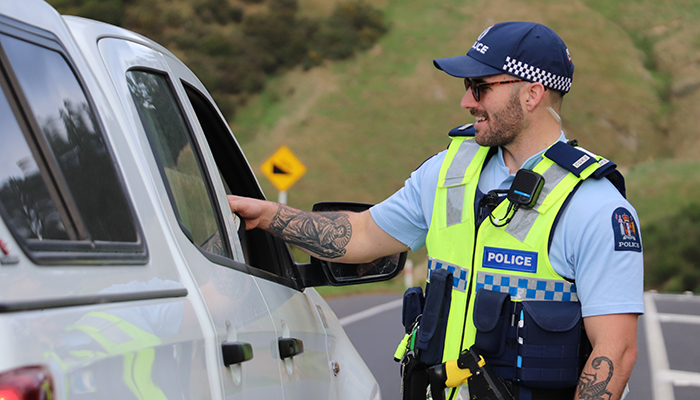 Officer chatting to a motorist at a checkpoint
