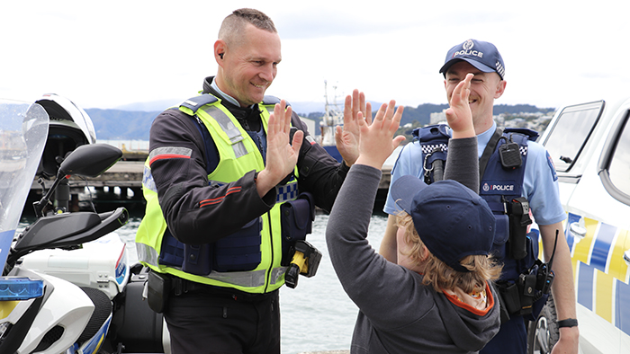 Constables Ash Williams and Seth Wilson give Elliot a high ten.
