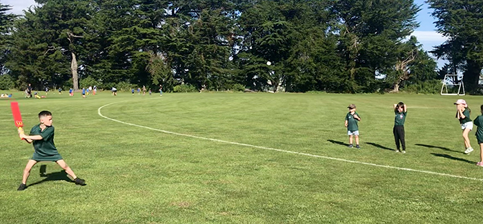 Some of the MiniGades playing cricket.