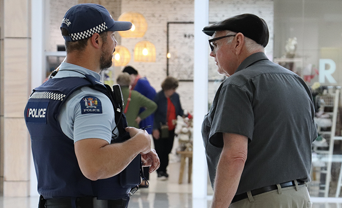 Constable Matt Thomson speaks with a shopper at Upper Hutt Mall. 