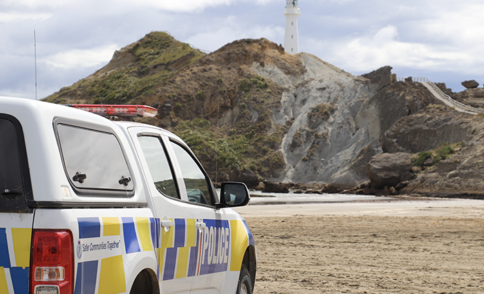 A 4x4 police vehicle at Castlepoint in front of the lighthouse