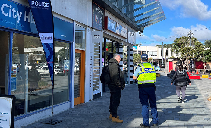 Staff engaging outside the pop-up hub in the Porirua CBD.