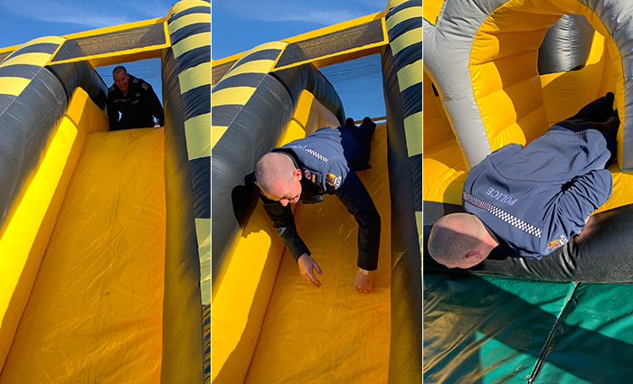 Ready, set go... Senior Sergeant Ben FitzPatrick demonstrates how a seal goes down a slide.