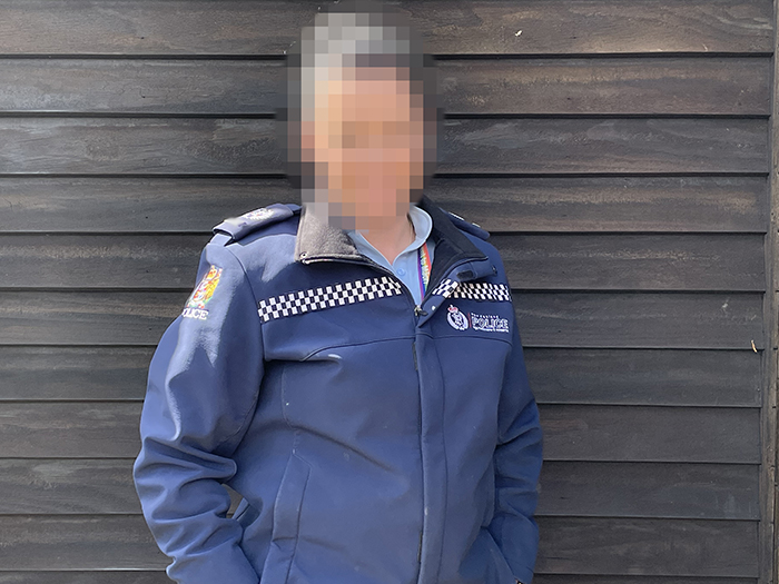 Genevieve: Senior Sergeant. Her name has been changed and face blurred to protect the identities of the parties involved.