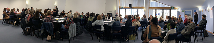 A panoramic shot of people sat at tables during the hui to discuss the Te Kura concept back in August 2020.