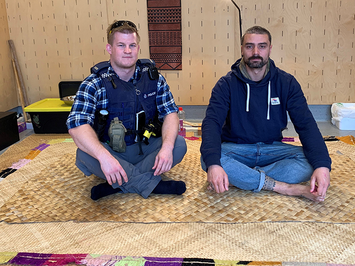 Constable Josh Downes with Moko Smith in his studio.