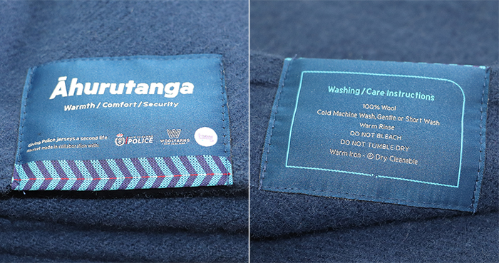Label on the blanket with its name on one side - ‘Āhurutanga’ (meaning warmth/comfort) - and washing instructions on the other.