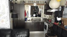 Another view of the kitchen and living area in the unit.
