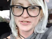 Jess wore black framed glasses