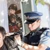 Officers arresting an offender.