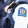 Photo showing police crest on arm of officer