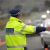 An officer diverts traffic.