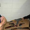 Constable Hadyn Korach and Arms officer Richard Plas with a selection of recovered guns