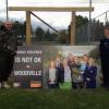 Pahiatua builder Joss Tua-Davidson and Tararua Family Violence Intervention Coordinator Constable Maxine Walshe install the Woodville billboard.