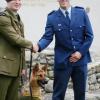 Constable Craig Moore congratulates Private Alex Baddock