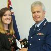 Commissioner Peter Marshall presents the Meritorious Service Medal to Kate Wilson, who received the award on behalf of her father, the late Superintendent Mike Wilson