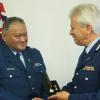 Commissioner Peter Marshall presents the Meritorious Service Medal to Sergeant Wayne Panapa