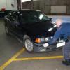 Police moving the recovered car into the examination bay