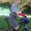 Jonathan McAdam with his new cast and cycle helmet that saved him from serious injury