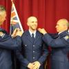 Constable Braden Drew has his epaulettes swapped over by Commissioner Mike Bush and Detective Superintendent Rod Drew.