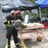 USAR team members cut shoring materials to help make the site safe
