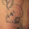 This tattoo is on the dead man's arm.