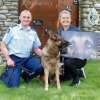 Police dog Arlo gives his seal of approval as Inspector Todd Southall presents Constable Jane Dunn her award