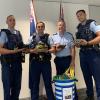 Acting Inspector Mark Clayton and Auckland staff involved in the Police Boot Bin Project