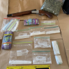 Police have seized firearms, drugs and cash. 