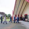 The manuhiri approach and enter Te Ngakaunui, the meeting house at Aotearoa Marae.