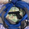 Cash and a firearm seized in relation to an investigation into the importation of meth from Malaysia