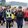 Police staff member and Special Olympics representative carry the torch 