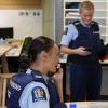 Police officer preparing to make enquiries to locate people